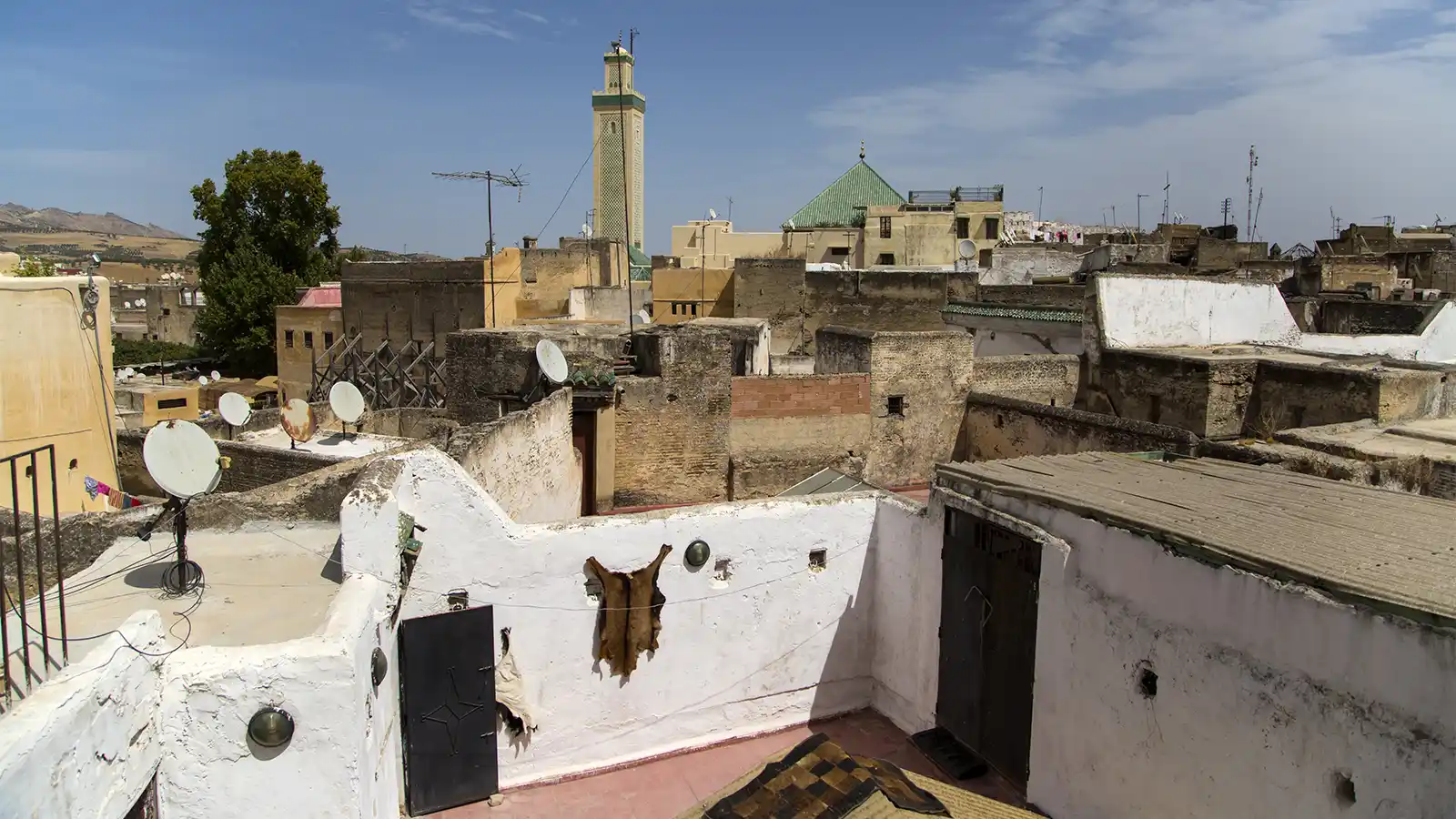 Fes food tour with old medina rooftops, minaret and cultural city view