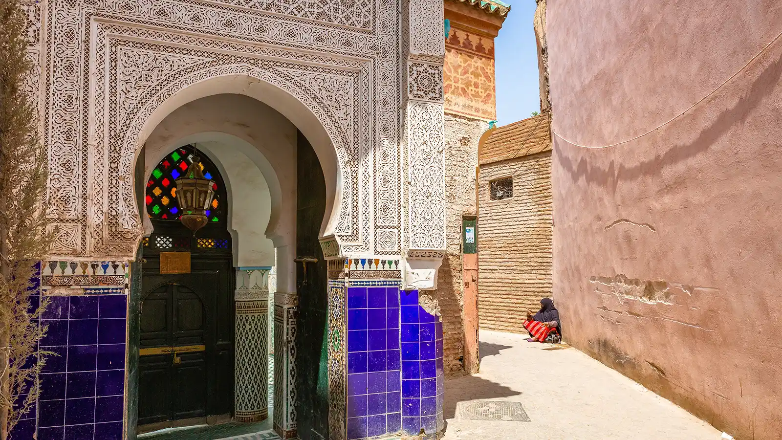 Marrakech medina guided tour with historic mosque architecture and heritage details
