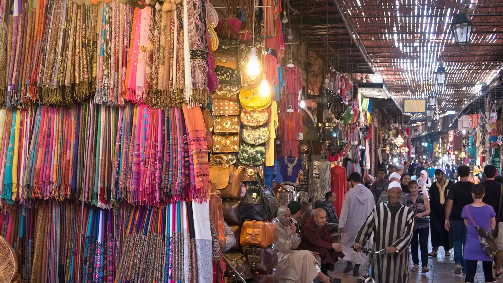 Marrakech souks shopping tour through a lively souk market with textiles and local crafts